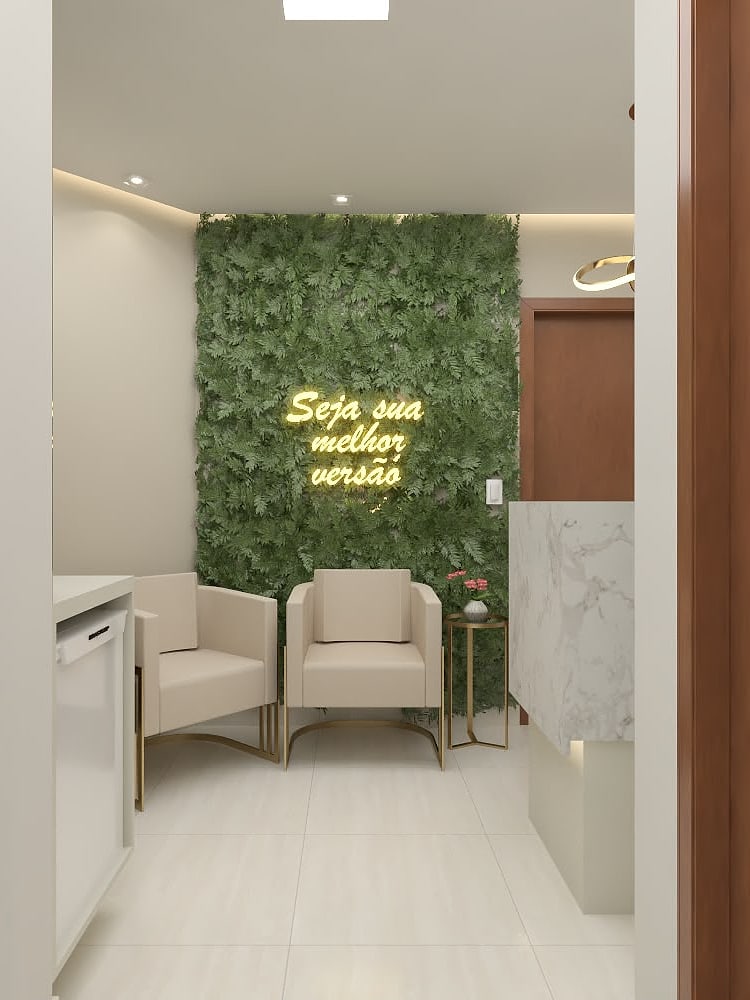 Sala de espera da Estética Giovanna Nathalie: parede verde com o letreiro Seja sua melhor versão e poltronas em tom creme